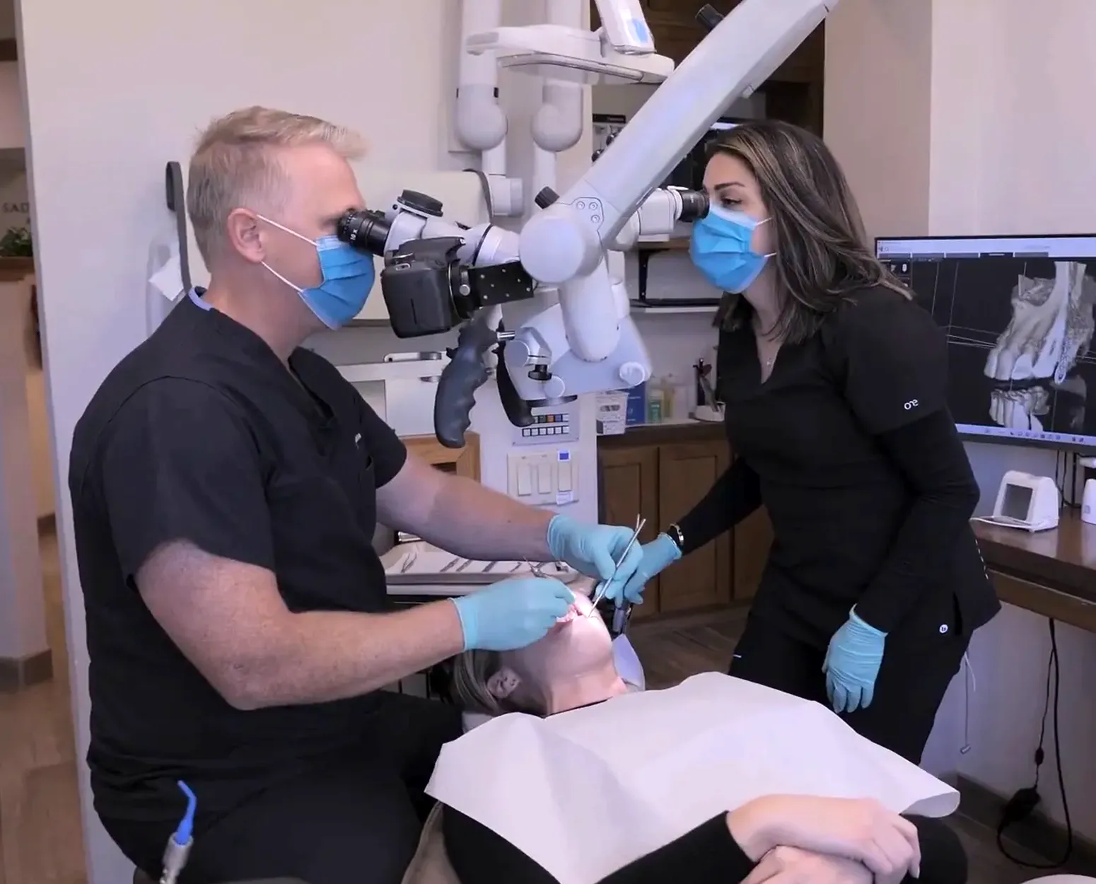 Endodontist performing root canal treatment